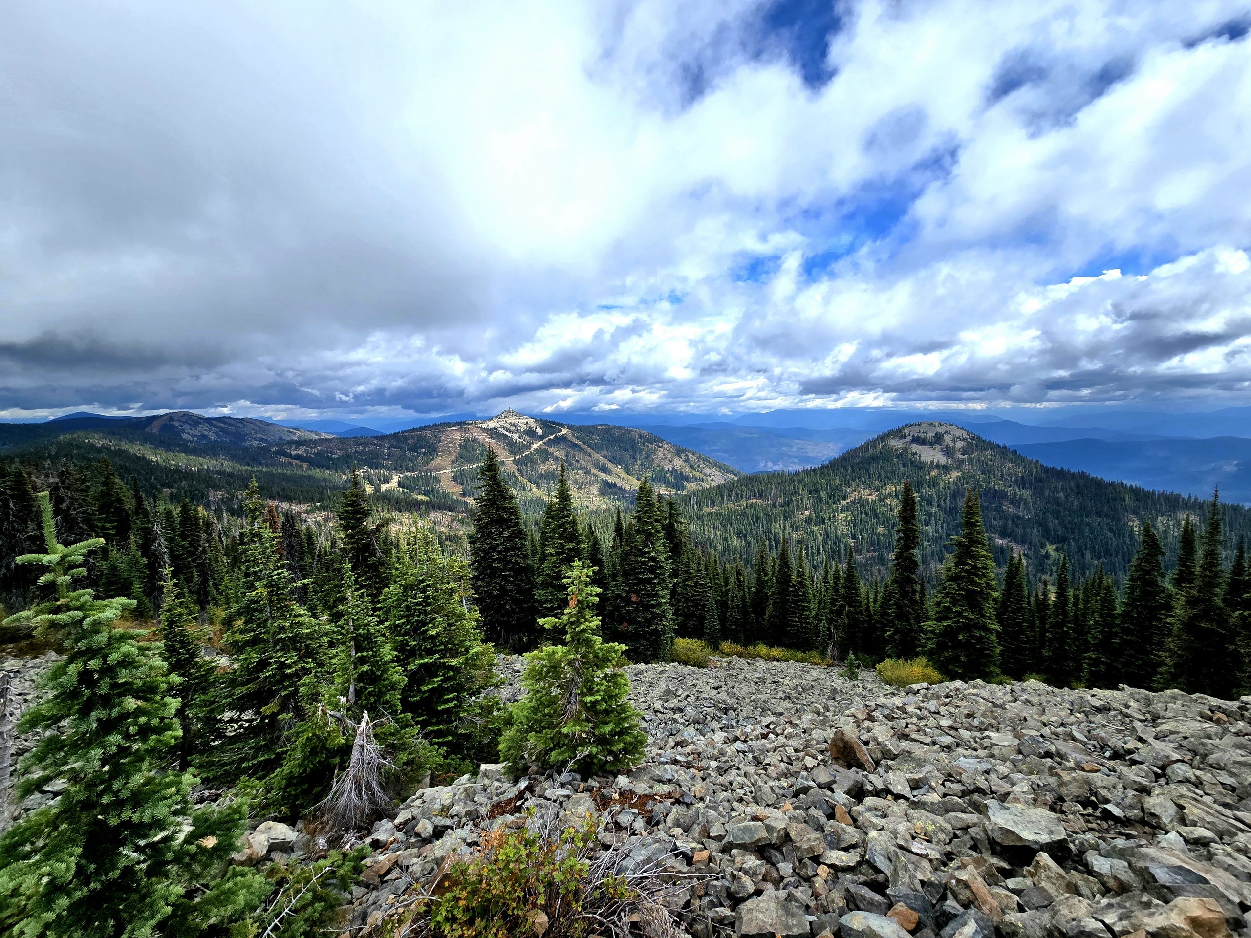 Ridges above Rossland with cloud caught between them.